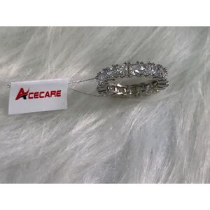 Plated Sterling Silver Emerald Shape Cubic Zirconia Eternity Band Ring Rhodium